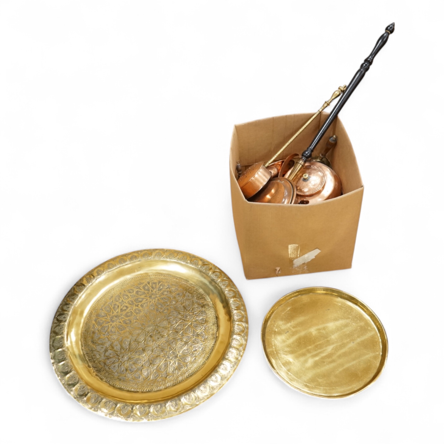 A group of metalware to include brass trays and copper warming pans